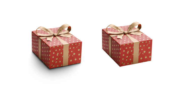 A red and and gold dot gift wrapped present with gold ribbon bows isolated against a transparent background with and without a shadow..