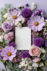 Top down composition of blank rectangular paper centered inside purple and pink floral wreath with cosmos, allium, roses, carnations, and greenery on soft lavender background © neirfy