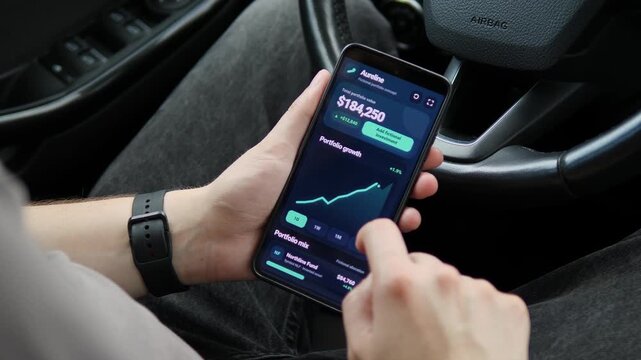Investor reviews rising portfolio performance on a smartphone, capturing mobile wealth management, market growth and the shift toward real-time personal finance.