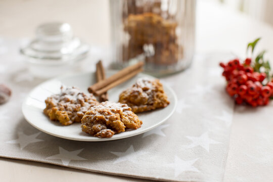 Close-up of a plate of Oatmeal and pumpkin cookies with cinnamon on a table