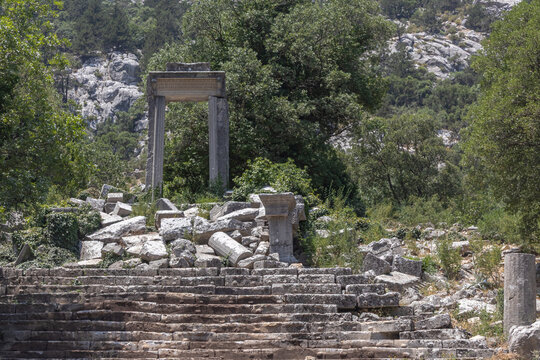 The ruins of Termessos. An ancient megalithic structure in Turkey. Ancient buildings of previous civilizations. Arches made of megalithic stone blocks.