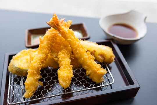 Appetizing crispy prawn tempura served with savory sauce in Japan