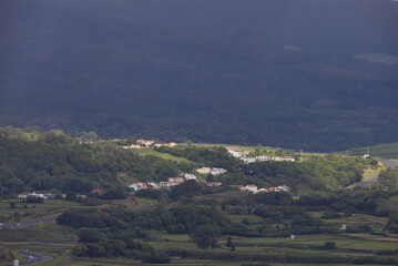 Obraz premium Terceira island rural village resting on green hills