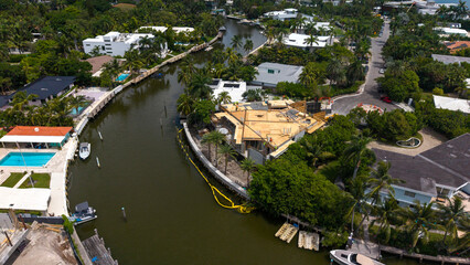 Fototapeta premium Aerial view of luxury waterfront home construction site in Miami