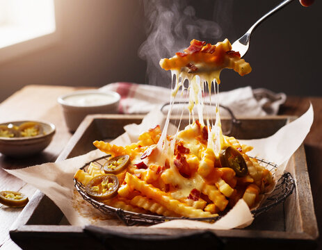 Eating loaded cheesy fries with bacon and jalapenos. AI