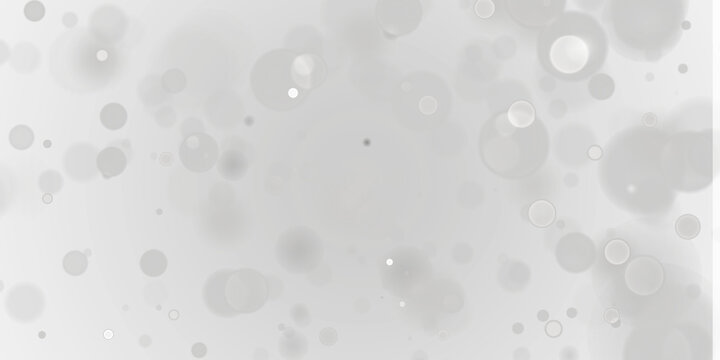 Silver and white bokeh lights with soft blurred glowing circles on a dark background, ideal for elegant holiday designs, winter banners, wedding invitations, luxury advertising