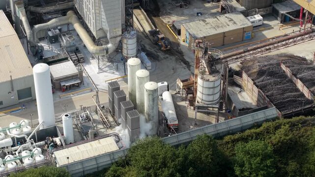 Aerial view of cryogenic liquid nitrogen tanks and ambient air vaporizers at an industrial facility in Harlow, England, United Kingdom.