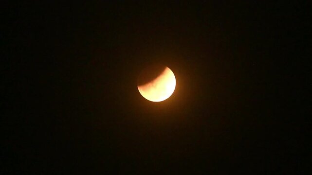 The Worm Moon total lunar eclipse, the last full moon of winter, the Moon moves from right to left as it passes through Earth's shadow. It was taking on a coppery red hue, known as a  "Blood Moon,''