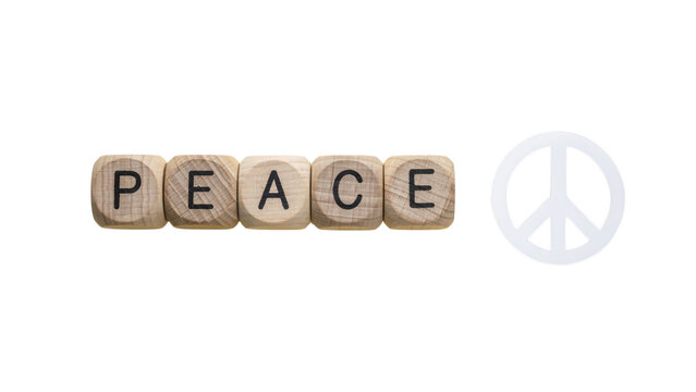 Peace word on wooden blocks with peace symbol, natural wood cubes on white background, concept of harmony and tranquility