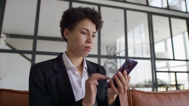 Concerned Employee Reading Troubling Phone Message