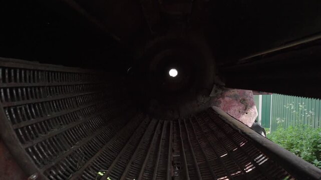 old red combine harvester repair threshing machine replacement of whips on the drum welding work to improve the efficiency of the unit