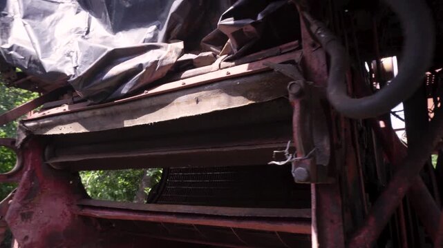 old red combine harvester repair threshing machine replacement of whips on the drum welding work to improve the efficiency of the unit