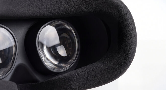 Detailed view inside a virtual reality headset showing the circular optical lenses and comfortable foam face padding
