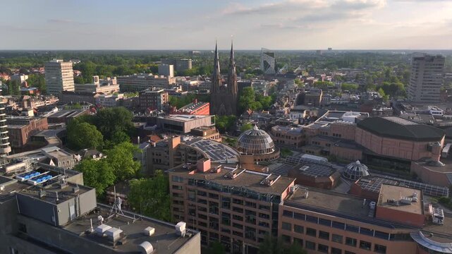 Eindhoven City in the Netherlands. Aerial Drone View City Center with Modern Buildings and Historical Catherines Church