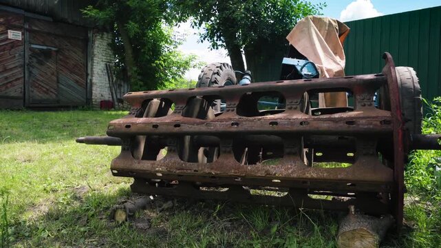 old red combine harvester repair threshing machine replacement of whips on the drum welding work to improve the efficiency of the unit
