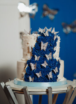 white cake with silver butterflies