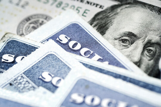 Social Security Cards with US One Hundred Dollar Bill $100