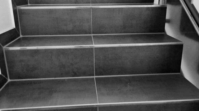 dark modern staircase steps, architectural design elements, geometric shapes, sleek black tiles, minimalist interior, construction details, vertical lines, urban structure, contemporary building