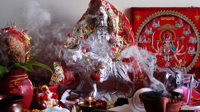 Burning Censer in Hindu Temple during Navratri festival at home in rural India. Faith trust hope concept.