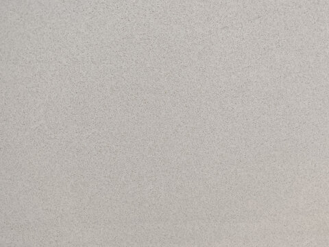 High-resolution full-frame photograph of a light gray fine-grain speckled plaster surface. Target applications include modern architectural background overlays, interior design mood boards, minimalist