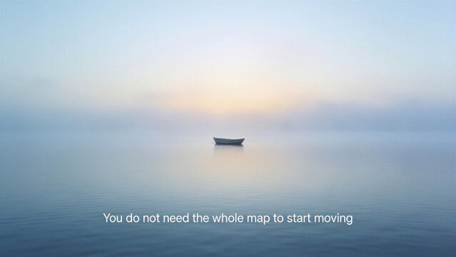 Lone boat on calm foggy sea with text quote "You do not need the whole map to start moving". Motivational quotes on starting a journey despite uncertainty.
