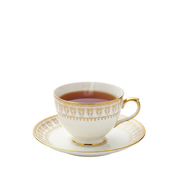 Close-up of a pristine fine bone china teacup and saucer with delicate 24k gold Victorian details, containing amber black tea with rising steam, on transparent. Concept of refined luxury and elegance