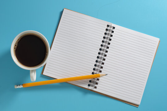 Coffee, Notebook and Pencil Flat lay