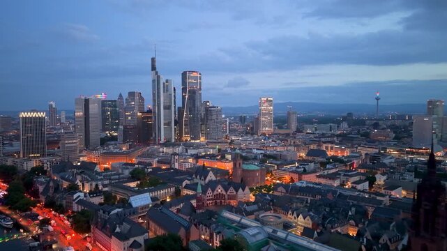 Erial Urban skyline at dusk with buildings and river in city of Frankfurt, Germany