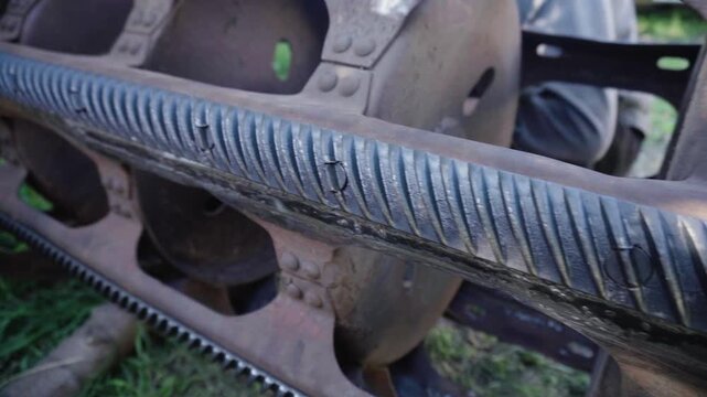 old red combine harvester repair threshing machine replacement of whips on the drum welding work to improve the efficiency of the unit