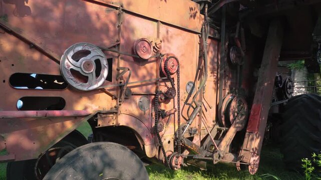 old red combine harvester repair threshing machine replacement of whips on the drum welding work to improve the efficiency of the unit