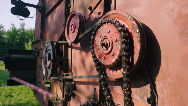 old red combine harvester repair threshing machine replacement of whips on the drum welding work to improve the efficiency of the unit