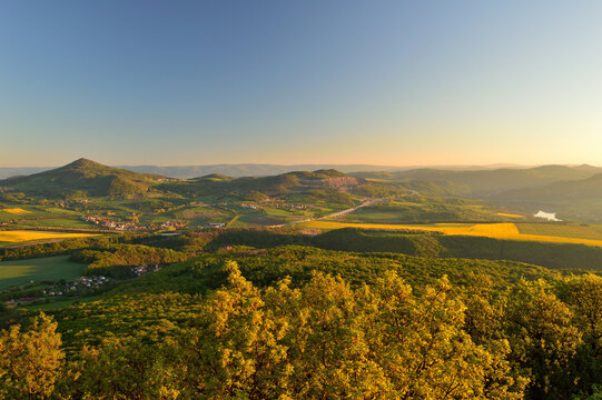 Magnificent sunset panorama from the summit of Lovos overlooking a highway bridge and the meandering Elbe river valley