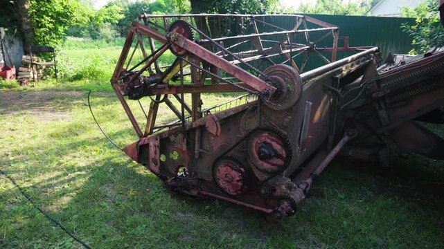 old red combine harvester repair threshing machine replacement of whips on the drum welding work to improve the efficiency of the unit