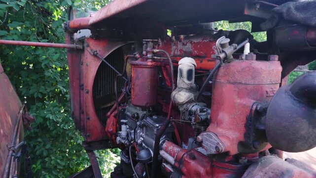 old red combine harvester repair threshing machine replacement of whips on the drum welding work to improve the efficiency of the unit