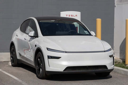 Tesla Model Y Electric Midsize SUV at a dealership. Tesla offers the Model Y with up to 327 miles driving range. MY:2026