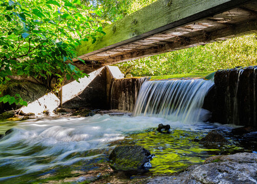 Water Pouring Over Small Dam Below Footbridge on The Manzanita Lake Trail, Lassen Volcanic National Park, California, USA