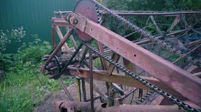 old red combine harvester repair threshing machine replacement of whips on the drum welding work to improve the efficiency of the unit