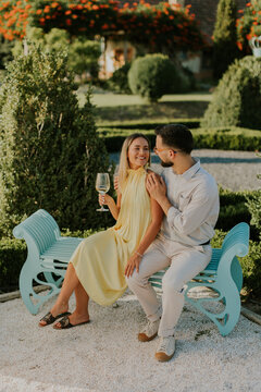 Elegant couple enjoying a joyful moment in a serene garden setting