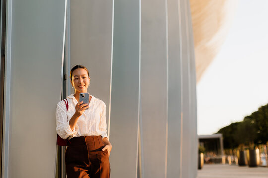 Joyful moments captured in a bustling cityscape with a Korean woman