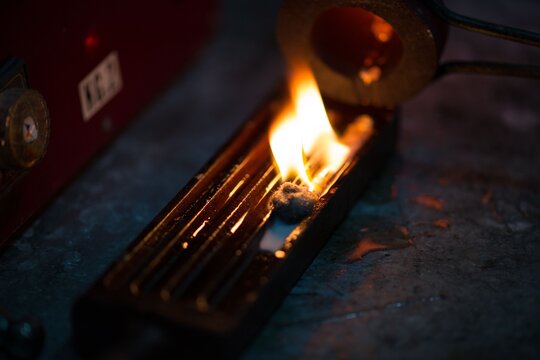 Molten Metal Being Poured into Casting Mold with Intense Flame