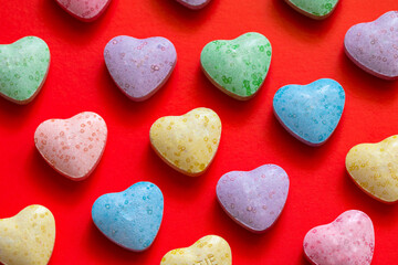 Obraz premium Colorful heart shaped candies background texture for Valentine day