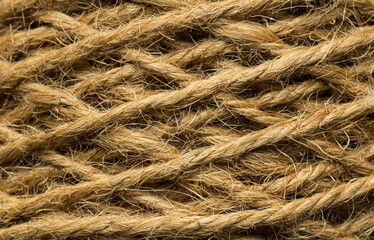 Fototapeta premium Close up of natural jute rope texture background,Macro,Macro close-up shot of rolled natural brown hemp or jute twine rope texture, showing intricate fiber patterns, twisted strands, and rustic.