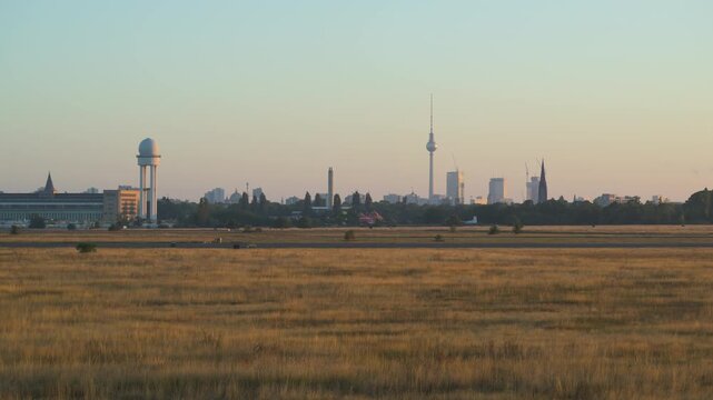 skyline of Berlin downtown from Tempelhofer Feld at sunrise 4K