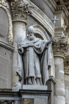 View of the stone statue of a saint holding a staff and emblem at the Uffizi Galleries in Firenze, Toscana, Italy.