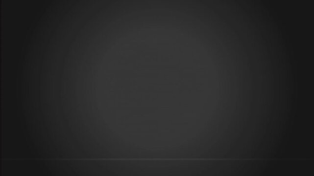 Abstract dark gray gradient background with soft spotlight illumination creating a smooth and minimalist professional texture