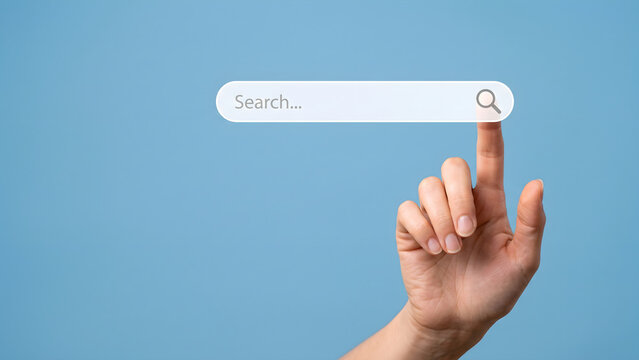 Searching for information online through a digital interface, a finger presses a search bar button on a blue background with copy space