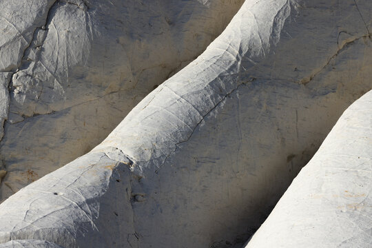 View of the white chalk formations at Tuzbair, featuring intricate textures and weathered surfaces in Mangystau District, Mangystau Region, Kazakhstan.