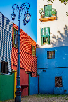 Vintage street lamp standing against colorful facades in Caminito, La Boca, Buenos Aires