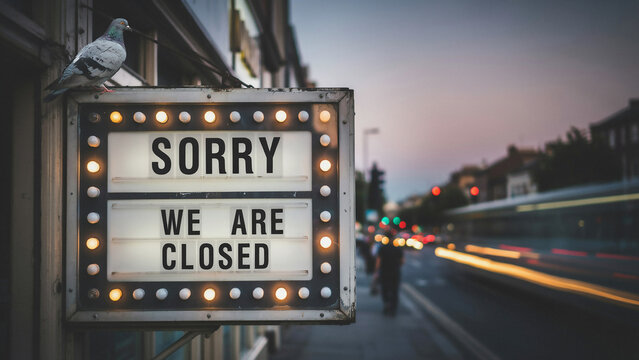 Sorry We Are Closed Retro Lightbox Sign on Street Exterior with Pigeon