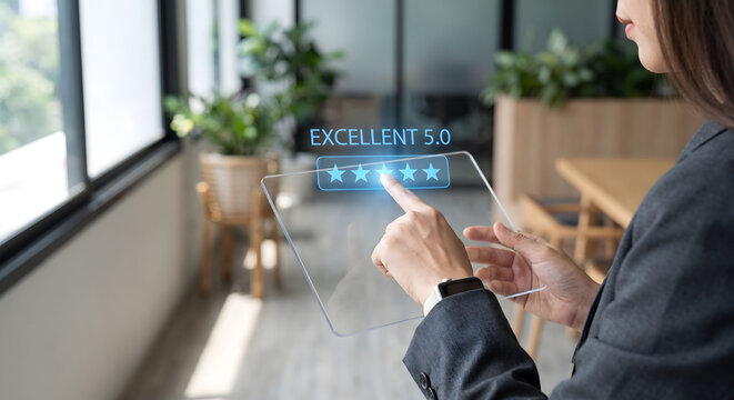 Businesswoman holding transparent tablet with virtual five star excellent rating hologram, Digital customer feedback and satisfaction concept with glowing UI on glass tablet.